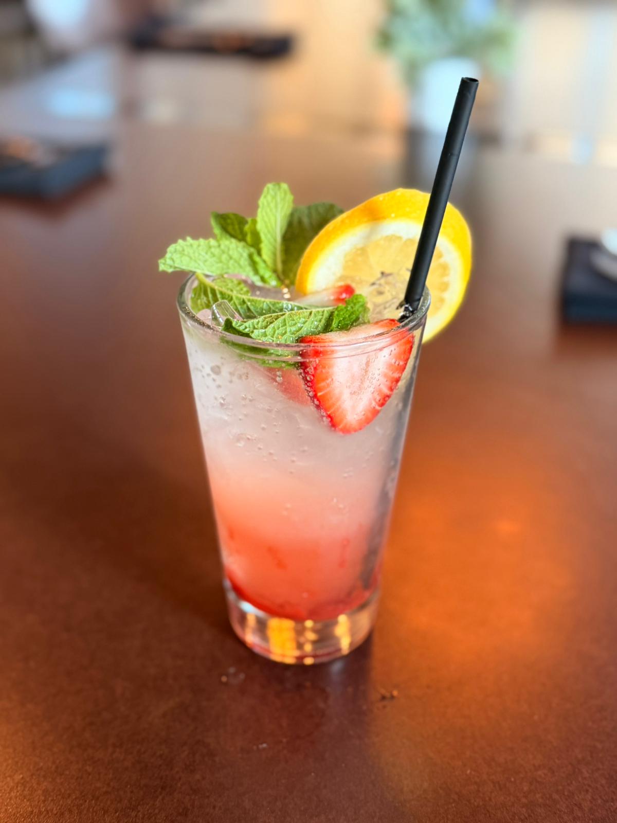 The Shag strawberry lemonade with fresh mint, strawberry, and an orange wheel