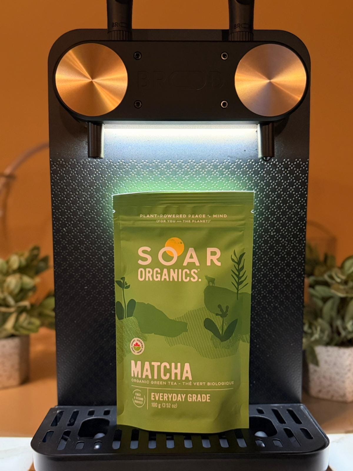 A pouch of Soar Organics organic Japanese matcha resting on the nitro tap